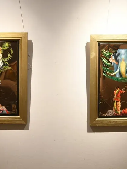 This pair of paintings on metal explores spiritual symbolism with the tiger and the elephant. The reflective quality of the metal adds a divine glow, enhancing the sacred feeling of the subjects.