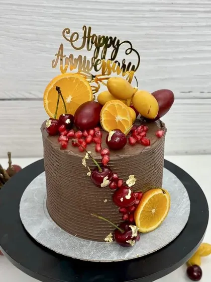 Another view of the fruit-loaded chocolate anniversary cake, showing off the rich colors and textures.