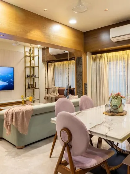 A look at a transitional living and dining area where modern and traditional styles meet. The layout connects the two zones, making it ideal for entertaining.