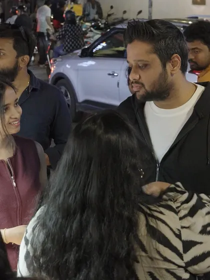 The best moments are the unscripted ones. Here, guests are gathered around the gifting station, chatting and sharing a laugh. Our goal is to create an interactive gifting booth that becomes a natural, happy hub of activity at your event.