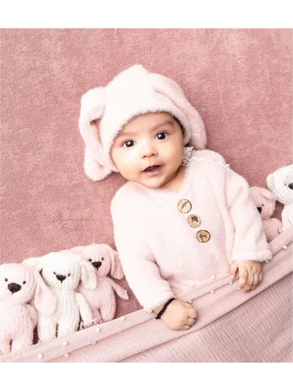 Three months is a magical milestone. This cozy setup with a pink-on-pink theme and adorable teddy bears is perfect for capturing their emerging personality.