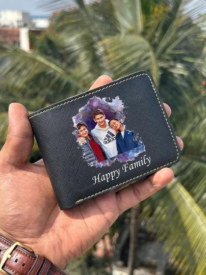 The black Saffiona wallet, personalized with a "Happy Family" photo.