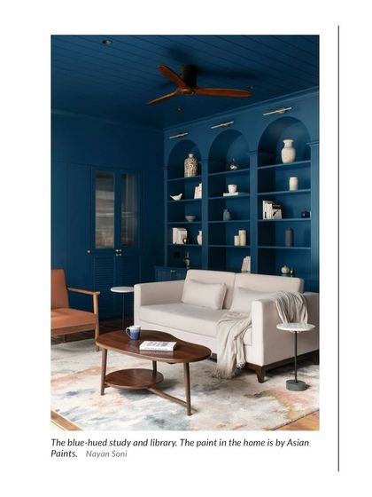 A press feature of our blue-hued study and library, noted for its visually captivating design and functional elegance.
