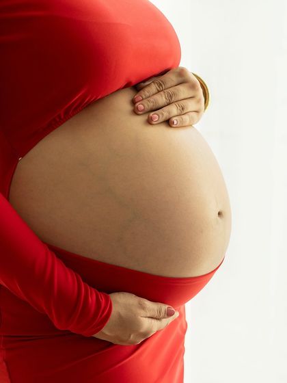 A detailed close-up of the beautiful baby bump. I believe in celebrating the real and honest beauty of the pregnant form, including the lines that tell a story of growth.