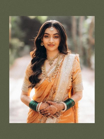 A beautiful, serene portrait of the bride. The soft focus and natural background create a gentle, timeless look that lets her natural beauty shine.