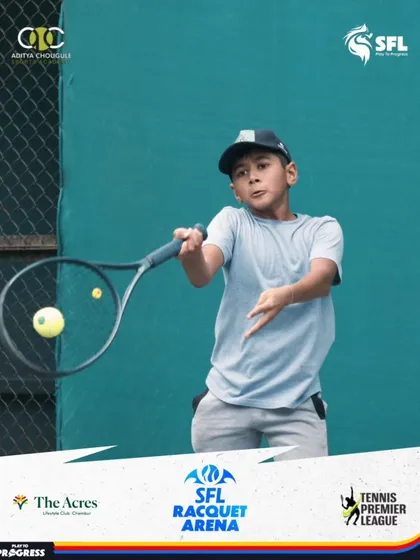 The moment of impact. This action shot captures the focus and technique of one of our students as he executes a forehand during a premier league match.