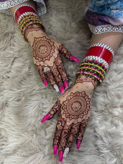 The beautiful stain of a Teej mehndi with lotus mandalas.