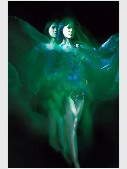 A multiple exposure image that creates a sense of fractured identity and movement. This technique visually represents Ophelia's complex emotional state.