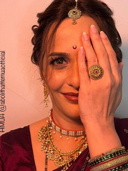 A creative shot for a Mangalagauri look, highlighting the traditional jewelry and the beautiful eye makeup.