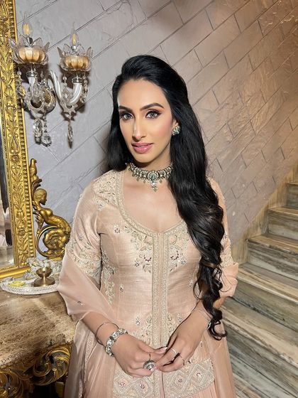 A close-up portrait capturing the ethereal radiance of the Roka makeup.