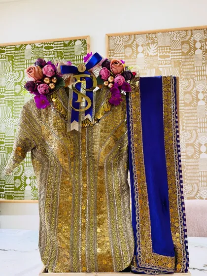 A regal gold and royal blue ensemble, adorned with a floral crown and the couple's initials. This is how I turn an outfit into a centerpiece.