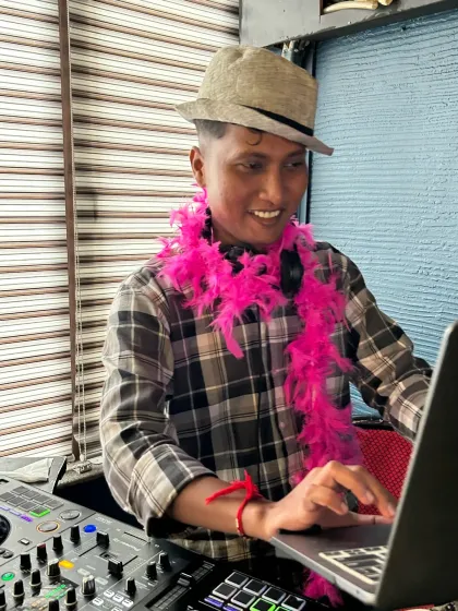 A fun moment from a retro-themed party. I love when guests get into the theme, and I always match their energy from behind the decks. My retro sets are all about bringing back those classic hits that everyone loves to sing and dance to.