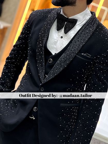 A detailed shot of a client in our black tuxedo with all-over crystal embellishments. This is the ultimate choice for a groom who wants maximum sparkle and glamour.