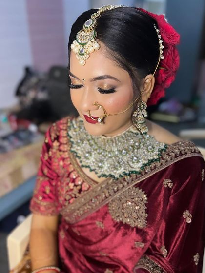 I'm born to shine bright. A glamorous North Indian reception look for the beautiful Sheethal, featuring golden glittery eyes and a classic red lip.