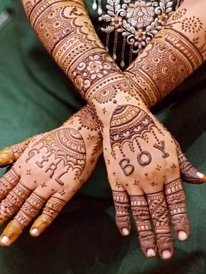 A sweet and simple baby shower design. We hid the words "GIRL" and "BOY" in the patterns to add a fun little secret to the mehendi.