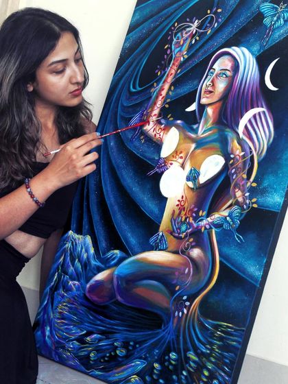 Here I am adding details to the 'reality creator' painting. The piece is about embracing the playful, powerful side of our soul.