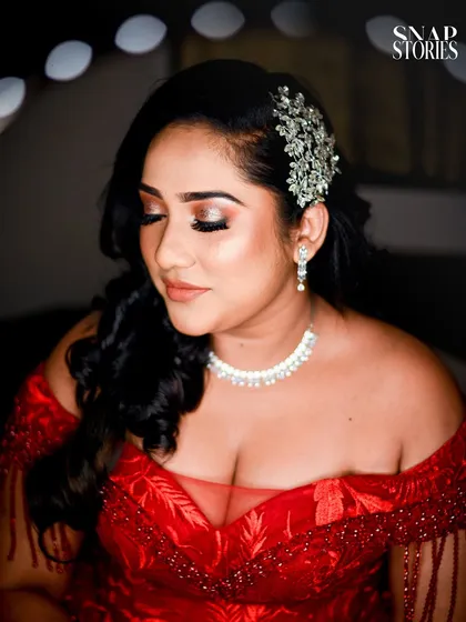 A stunning close-up of the bride, showcasing her flawless makeup, elegant hairstyle, and beautiful jewelry. I work to capture every detail that makes you feel special.