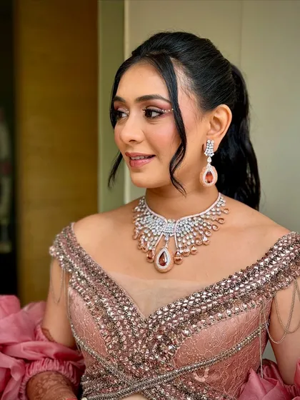 Another close-up, showing the details of her diamond necklace and the soft, glowing makeup.