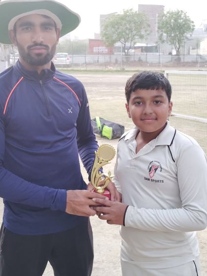 A junior player being awarded for his excellent performance. We recognize and nurture talent across all age groups.