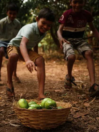 A dynamic shot of children playing around a basket of mangoes. The motion and excitement in this photo bring the scene to life.