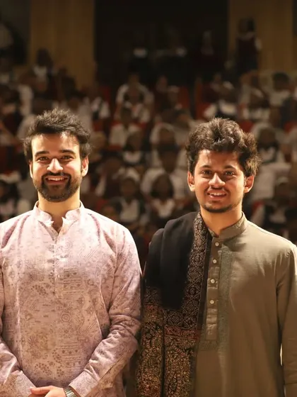 A group photo with fellow artists and organizers after a successful concert for a young audience. Sharing our music with students is always a rewarding experience.