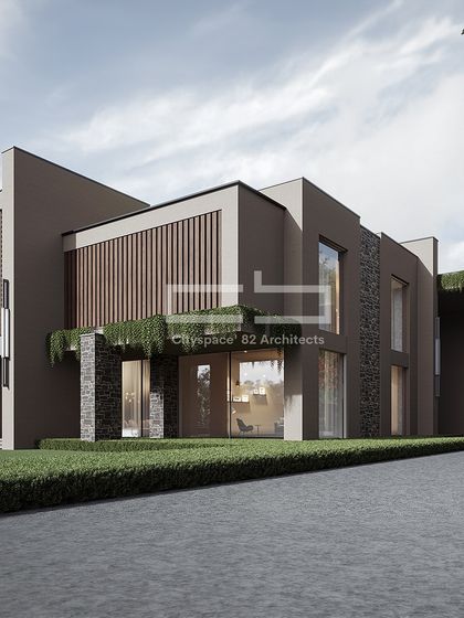 This architectural masterpiece redefines opulence, combining a striking, dark-toned facade with lush surroundings for an unparalleled blend of style and comfort. The design plays with solid volumes and transparent surfaces to create a bold statement.