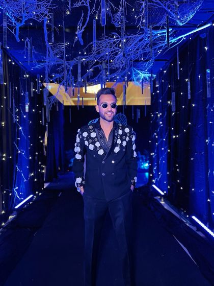 Posing in a stunningly decorated blue-lit hallway at the Thailand wedding venue. The ambiance of a destination wedding is always inspiring.