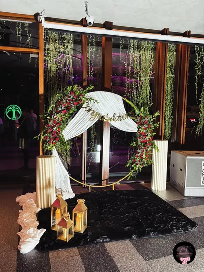 A full shot of the "Congratulations" arch at night, showing how the setup looks with indoor lighting.