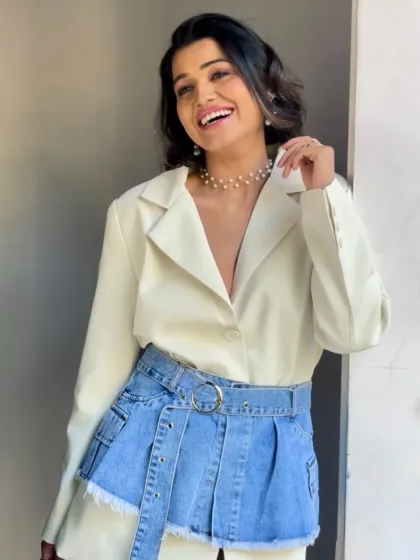 The same look captured with a joyful expression, proving that editorial makeup can feel natural and enhance personality. The glowing skin and bright eyes are perfect for fashion stories that aim to be both aspirational and relatable.