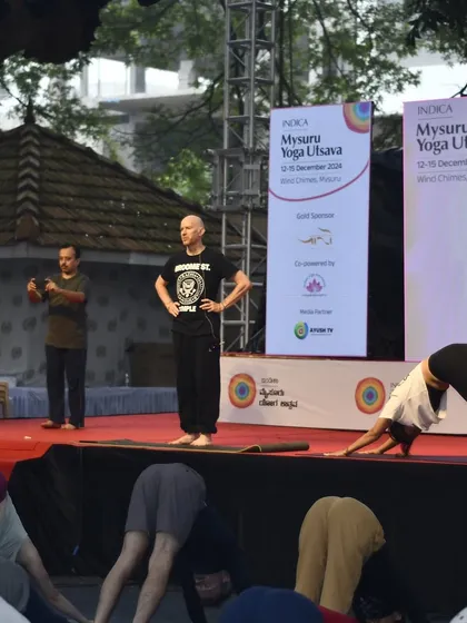 Demonstrating Adho Mukha Svanasana on stage at the Mysuru Yoga Utsava, alongside my teacher Eddie Stern. This event was filled with grace, abundance, and synchronicity.