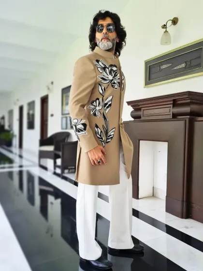 Full-length view of the hand-painted beige indowestern, showcasing its unique artistic flair.