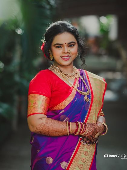 A classic, smiling portrait of the bride. She looks directly at the camera, her happiness and bridal glow evident in this beautiful engagement photo.