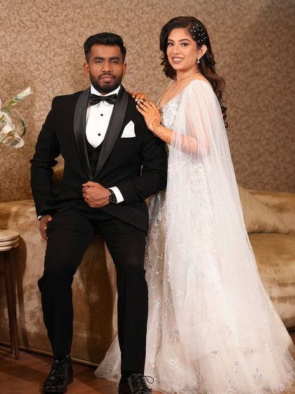 A stylish portrait of the couple. Her makeup is glamorous yet elegant, perfect for a modern engagement party.