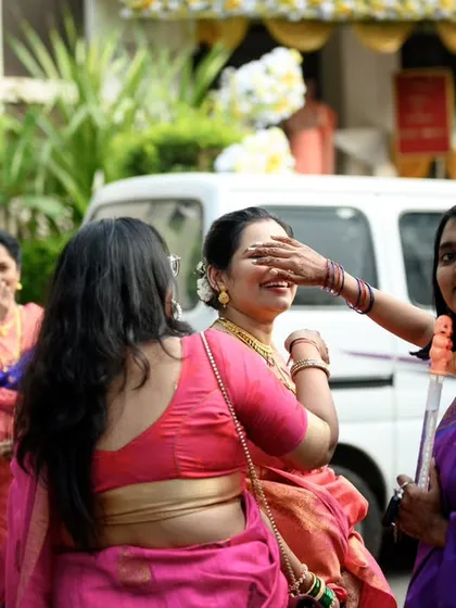 A playful moment between the bride and her friend. These candid interactions are what make wedding photos feel personal and unique.