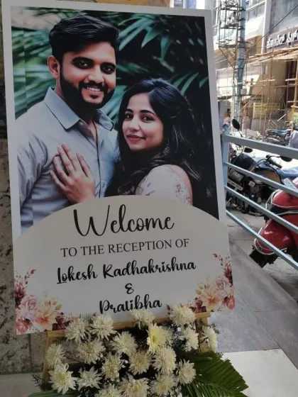 A personalized welcome board sets the tone for your event right from the entrance. For this reception in JP Nagar, I designed a sign with the couple's photo and arranged it with fresh flowers to greet guests as they arrived.
