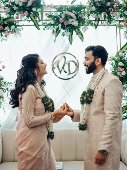 It's the unposed, joyful moments like this that truly tell your story. We focus on capturing the genuine laughter and connection between a couple during their engagement ceremony.