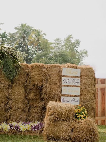 Another view of the impressive hay bale structure, showcasing its height and texture.