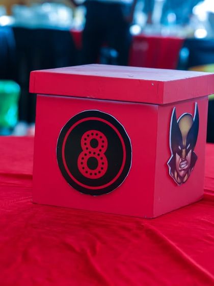 A custom table centerpiece for the 8th birthday party, featuring a Wolverine character detail.