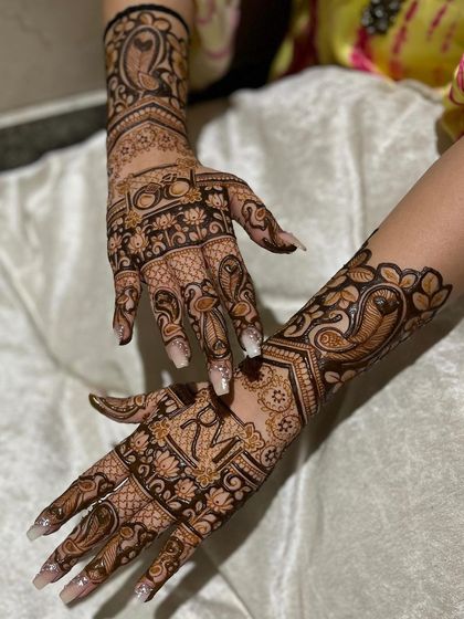 Another angle of the engagement mehndi, showing the beautiful symmetry and detail on both hands.