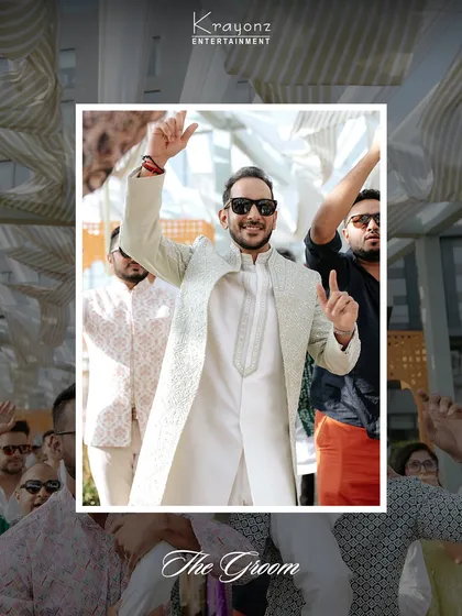 The groom makes his entrance at the Mehendi party, full of energy and ready to celebrate with his friends and family.