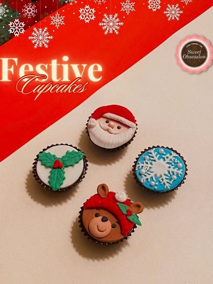 A graphic showcasing four of my most popular festive cupcake designs. These include a Santa face, a teddy bear in a hat, a snowflake, and a sprig of holly.