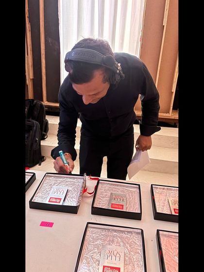 A team member preparing the awards backstage at the Elle Style Awards. Our awards management is precise and organized.