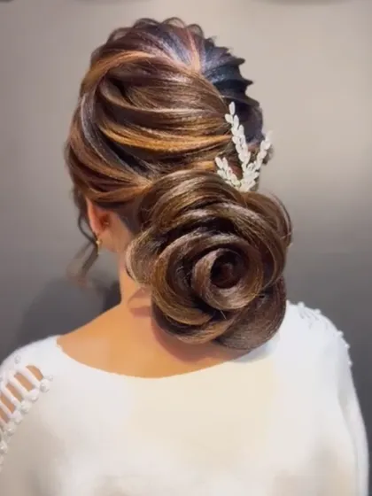 Another angle of the stunning rose bun, highlighting the intricate petal-like details.