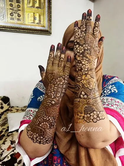 A stunning full-coverage bridal henna design, showcasing the beautiful results of my organic cones. The intricate patterns cover the hands and arms completely for a traditional bridal look.