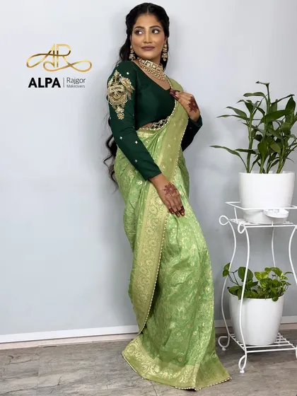 A full-length view of the green saree look, showing how the hairstyle complements the overall elegant attire.