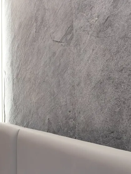 A close-up of the natural texture of the thin-cut granite slab. This is how I use materials to add character and a sense of quiet grandeur to a space.