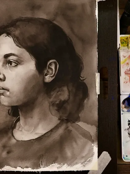 A work-in-progress shot of a monochrome portrait study. This shows the painting on the easel next to my palette, giving a glimpse into the workshop environment.