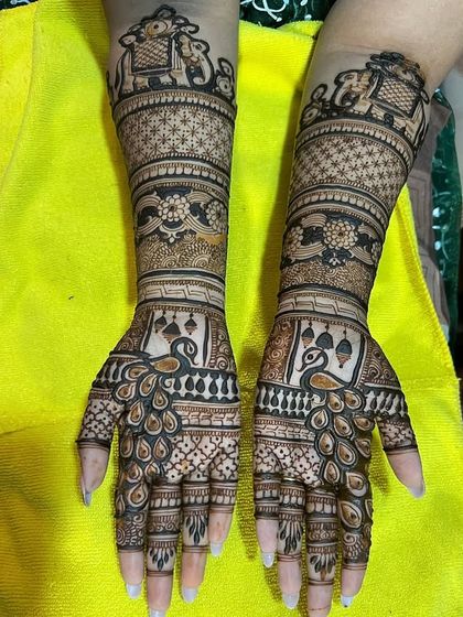 A beautiful peacock and elephant themed bridal mehndi. The intricate details and clean lines are a testament to the skill of my artists.