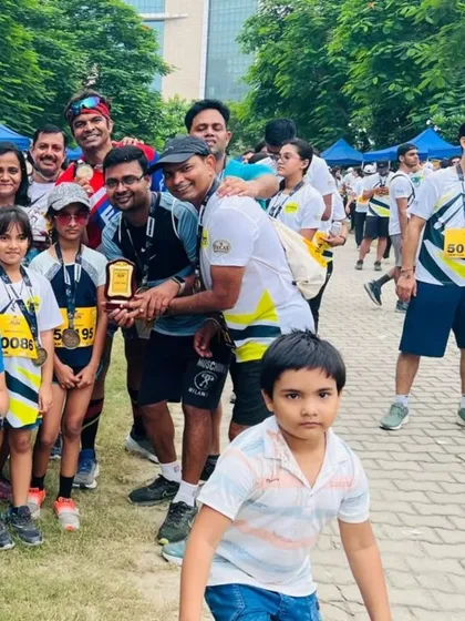 The Wishtown Runners group celebrating with their trophy. We love seeing running clubs and corporate teams participate in our events.