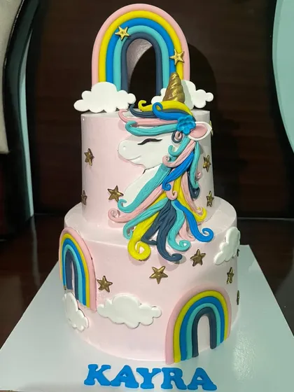I love bringing magical themes to life, like this two-tiered unicorn cake for a special birthday girl. This custom eggless cake features colourful fondant rainbows, clouds, and a beautifully crafted unicorn, making it a dream come true for any kids' party in Gurgaon.